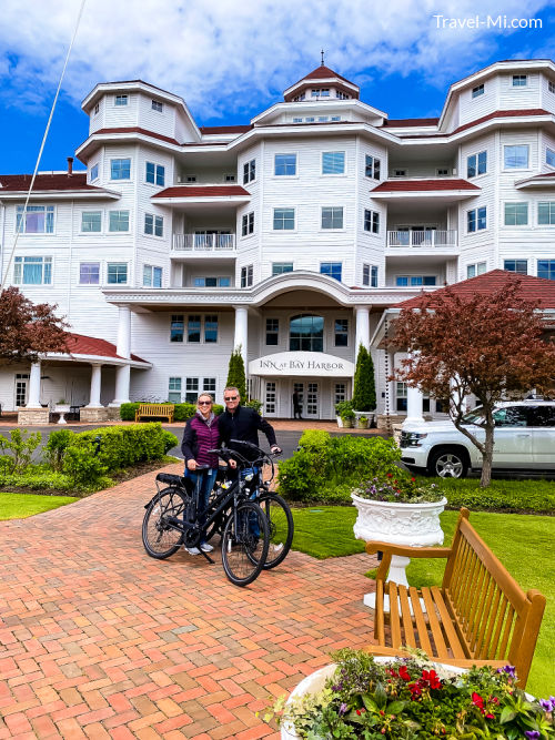 Sherry and Chris on bikes in front of the Inn at Bay Harbor